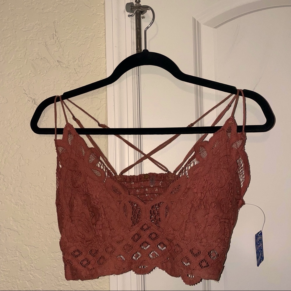 Large Free People bralette/crop top in the color copper.
